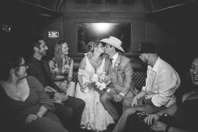 Lamm wedding reception at Eagle Dancer Ranch exit bus kiss