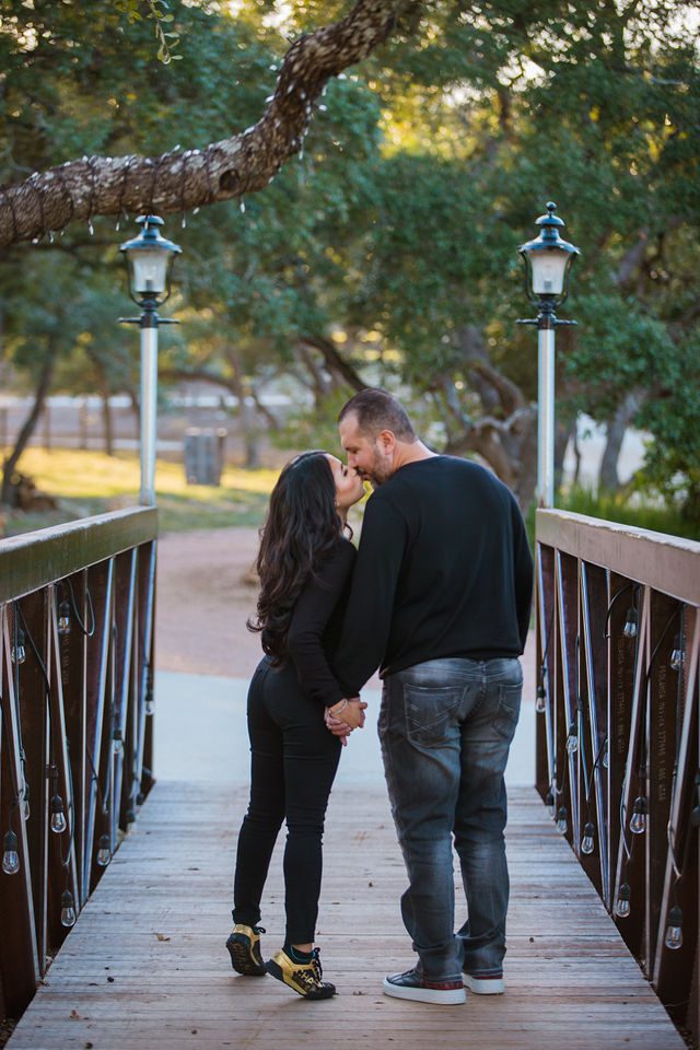 Park 31 engagement session with Erica Straughan Photography on the bridge kiss
