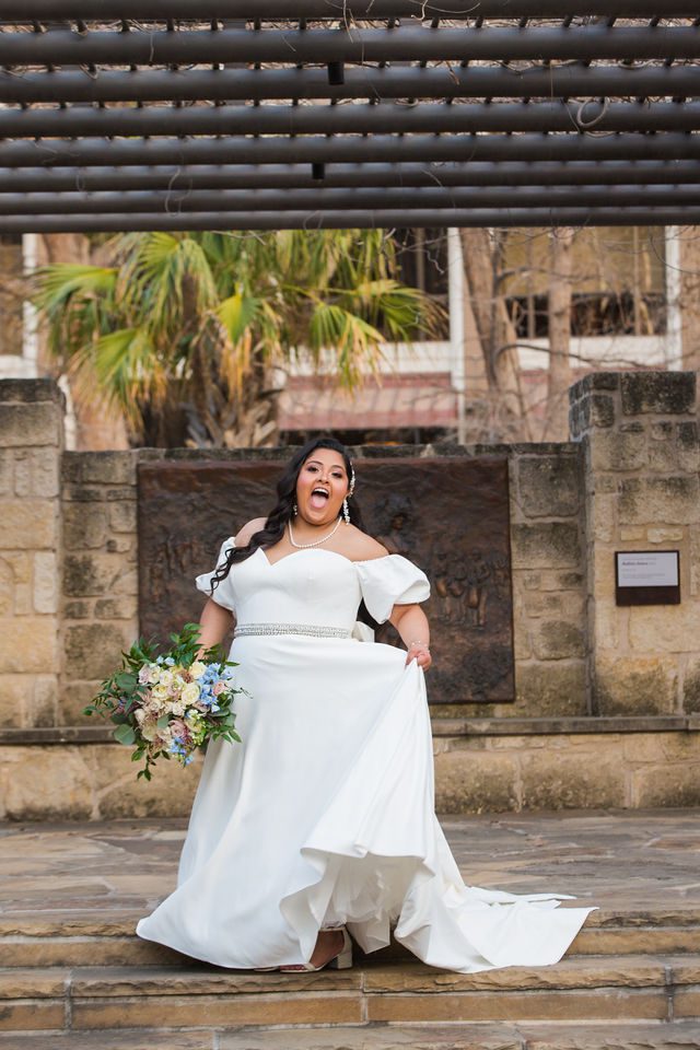 Maddie's bridal at The Briscoe in San Antonio bride laughing