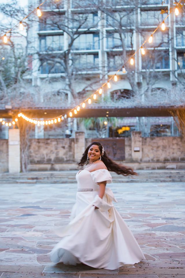 Maddie's bridal at The Briscoe in San Antonio twirling on the patio