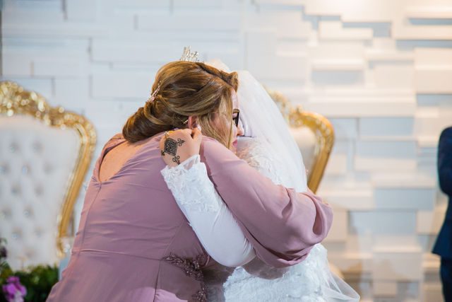 Selma's wedding at Olympia Hill San Antonio bride hugging at the reception