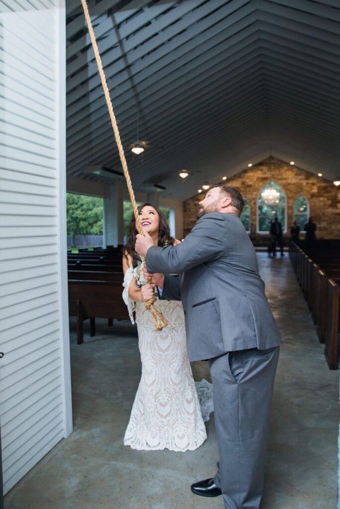 Missie's wedding ceremony at the Chandelier of Gruene ringing the bell