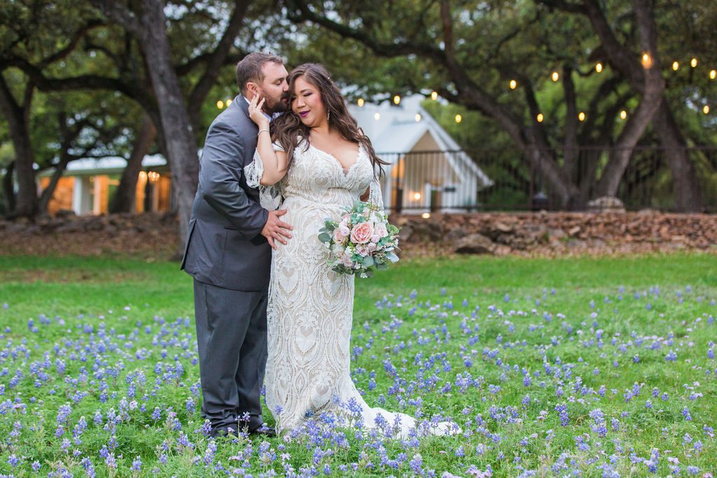 Missie's wedding at the Chandelier of Gruene couple in the bluebonnets