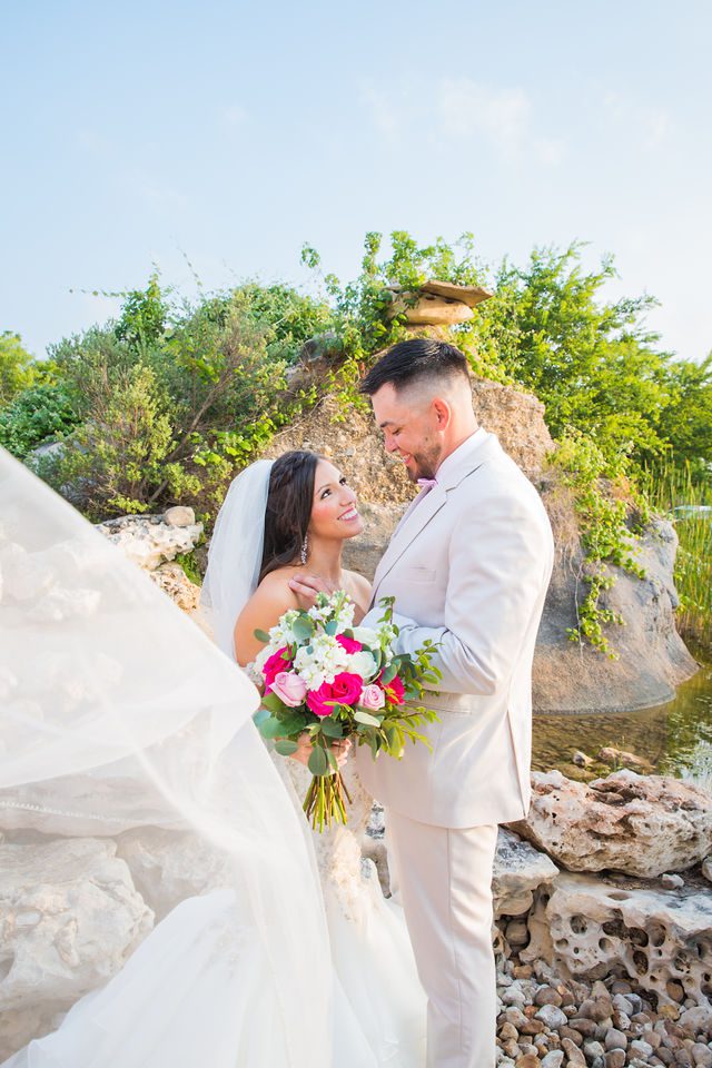 Hollubs wedding at Geronimo Oaks in San Antonio bride in front of fountain