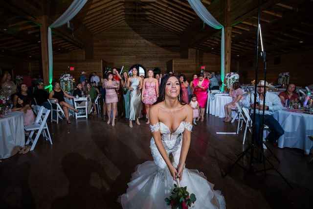 Hollubs wedding at Geronimo Oaks in San Antonio reception bouquet toss