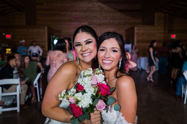 Hollubs wedding at Geronimo Oaks in San Antonio reception bouquet toss winner
