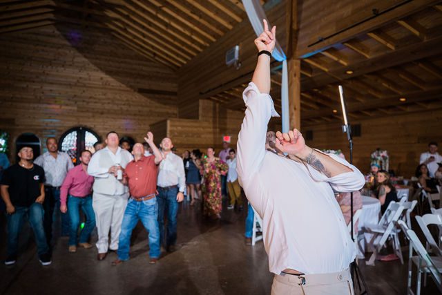Hollubs wedding at Geronimo Oaks in San Antonio reception garter toss