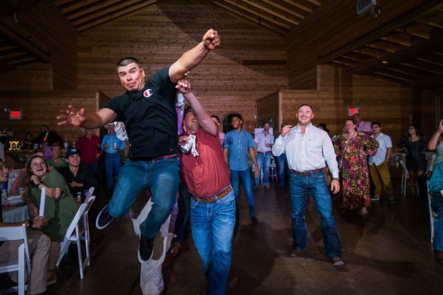 Hollubs wedding at Geronimo Oaks in San Antonio reception garter throw