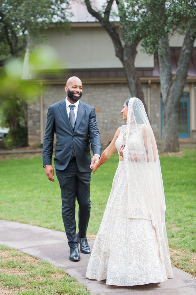 Nida wedding Club of Garden Ridge in San Antonio groom and bride walking