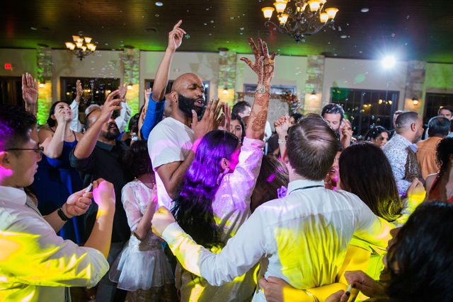 Nida wedding reception Club of Garden Ridge in San Antonio groom bouncing