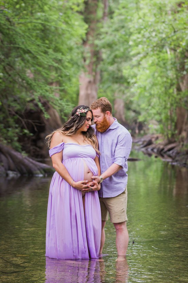 Yoli maternity session at Cibolo Natural Area couple hugging in the water