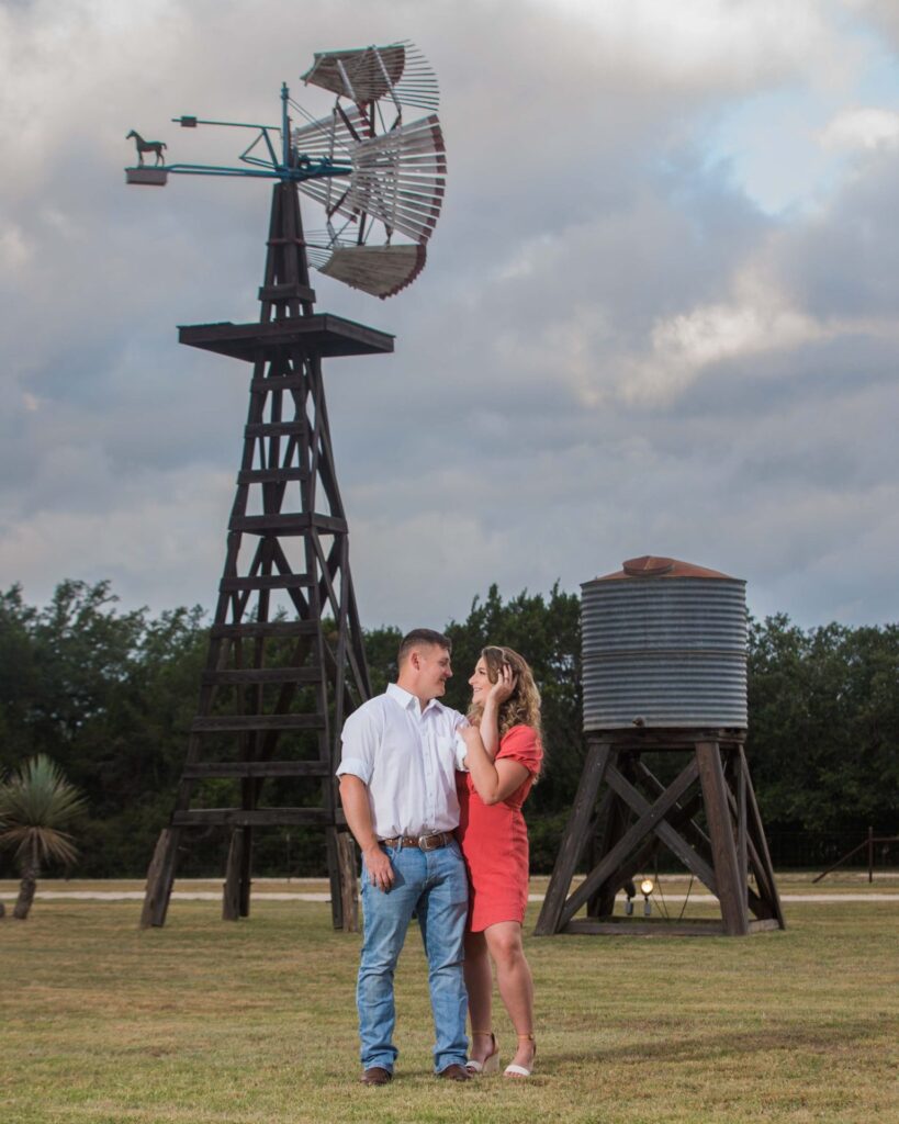 Brighten's engagement session at Western Sky in San Antonio couple portrait with windmill