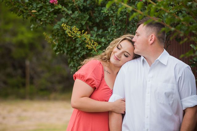 Brighten's engagement session at Western Sky in San Antonio in front of the flowers