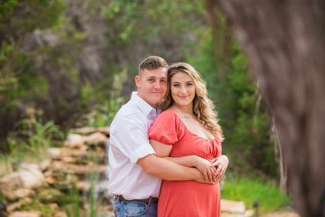 Brighten's engagement session at Western Sky in San Antonio couple by waterfall