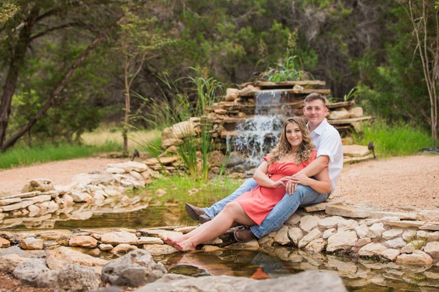Brighten's engagement session at Western Sky in San Antonio sitting by water