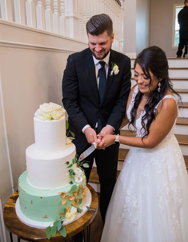 Nadine's wedding at Kendall Point in San Antonio reception cake cutting