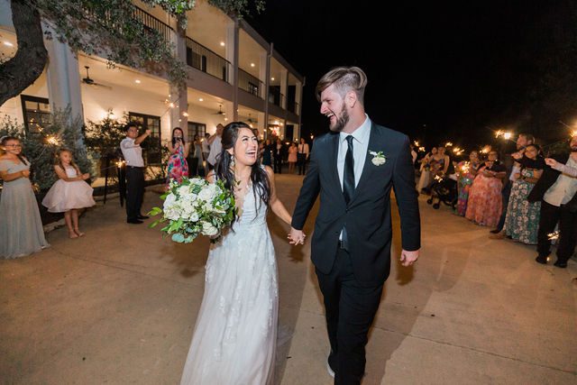 Nadine's wedding at Kendall Point in San Antonio reception sparkler exit laugh