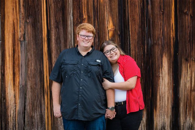 Ryanne engagement at Gruene Hall in New Braunfels portrait by rustic wall