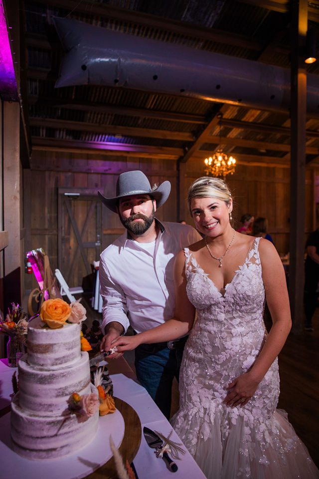 Kirt A's wedding reception at Eagle Dancer Ranch cake cutting