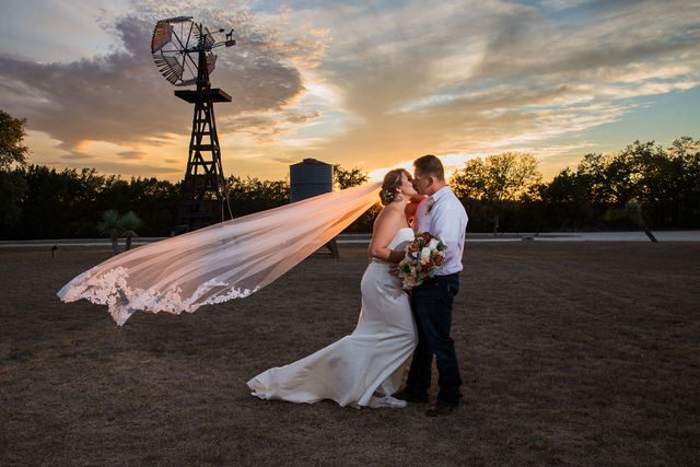 Brighten wedding at Western Sky couple at sunset kiss portrait