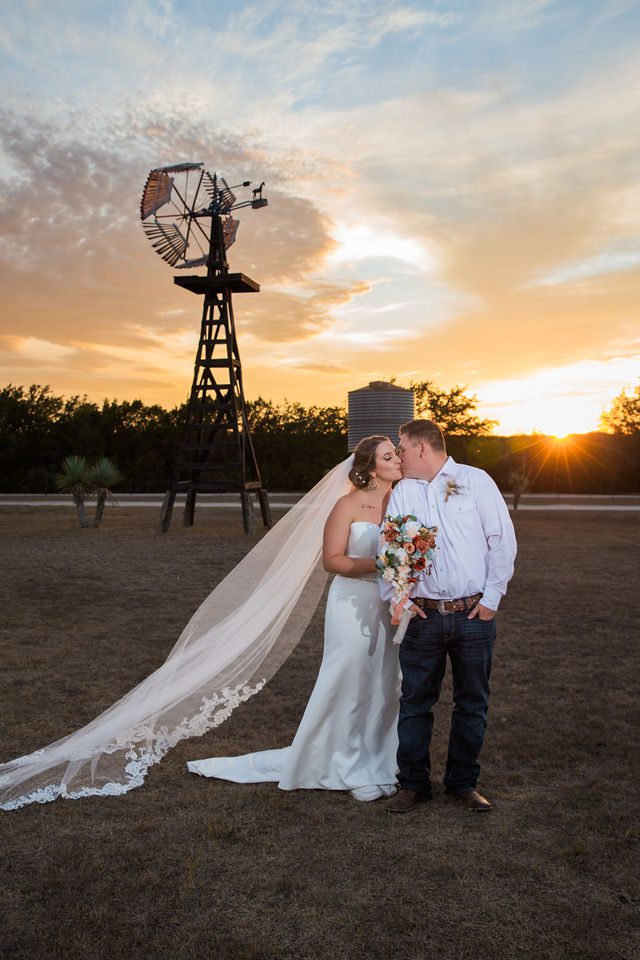 Brighten wedding at Western Sky couple at sunset kiss portrait at windmill