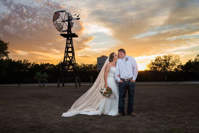 Brighten wedding at Western Sky couple portrait at sunset kiss