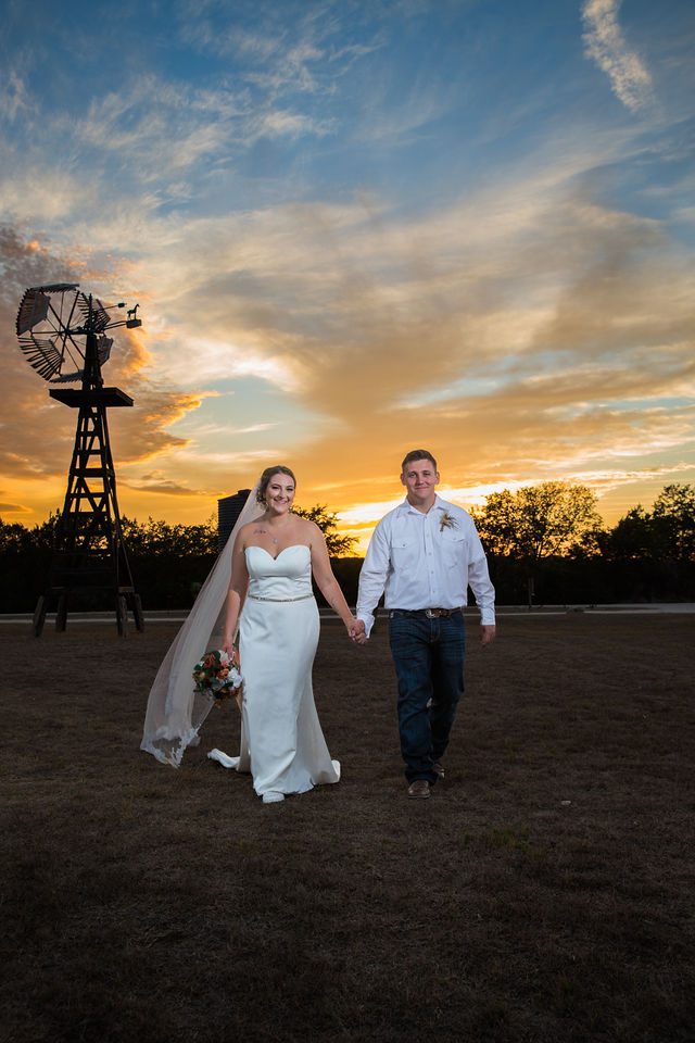 Brighten wedding at Western Sky couple walking portrait at sunset