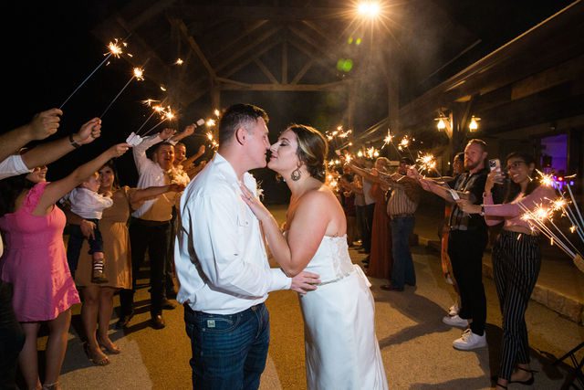Brighten wedding reception at Western Sky sparkler exit kiss
