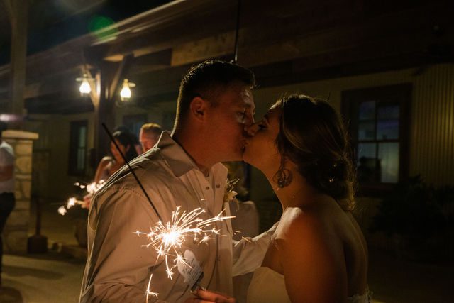 Brighten wedding reception at Western Sky kiss with sparkler