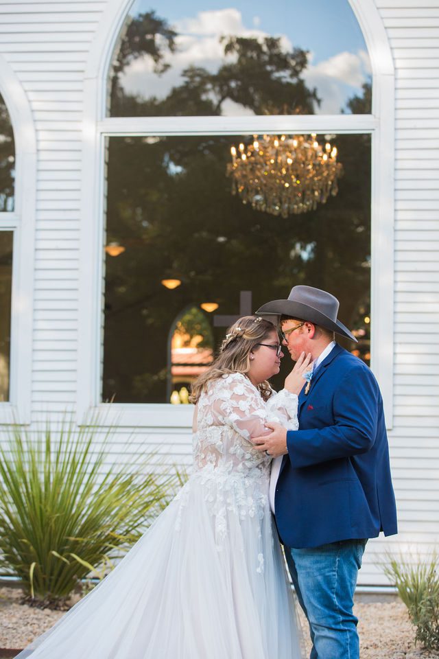 Ryanne's Wedding at the windows at Chandelier of Gruene couple portraits